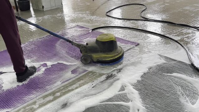 Carpet cleaning using a special vacuum that creates a large amount of foam.