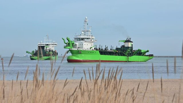 Working dredger ship at port construction in Gdansk Poland