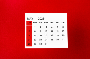 The May 2023 Monthly calendar for 2023 year on red background.