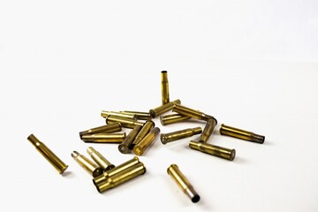 assault rifle cartridges and bullets falling into frame ammo on a white background