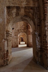 Fototapeta na wymiar Castano del Robledo, Huelva, Spain, April 2, 2023: Small side arches of the unfinished Church (18th century) of Castano del Robledo, Huelva. Spain