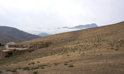 Clay house on a steep slope