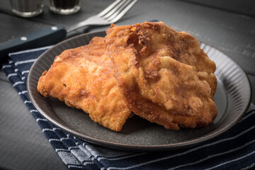 Two fried cod fillet pieces.