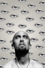Collage art in surrealism style with a man on female eyes background