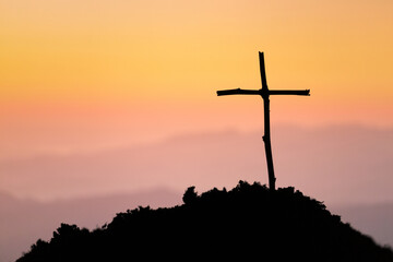 Crucifixion Of Jesus Christ - Cross At Sunset. The concept of the resurrection of Jesus in...