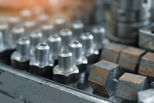 These are close-up metal fittings and adapters. Production of adapters for pipes in turning workshop..