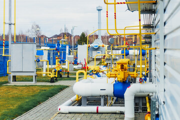 This is new gas compressor station on summer day. View of production facility from outside. Pipes...