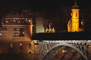 El Cachorro entrando en su barrio de noche. El cachorro en el Puente de Triana. Triana bridge. Very famous religious image.