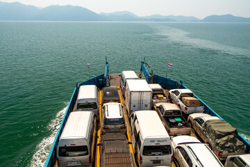 Naklejka premium Thai ferry boat with cars on deck at sea to Koh Chiang Thailand