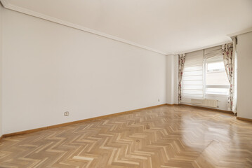 Empty room with white aluminum window with floral curtains and oak parquet floor