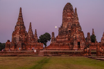 Fototapeta na wymiar Ancient temples in Ayutthaya, Thailand, with full moon, sunset