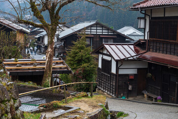 Fototapeta na wymiar Preserved old wooden buildings in town of Tsumago juku, Kiso valley