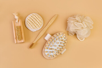 Various eco frendly items from bathroom for face and body care and hygiene on beige background with Copy space. Zero waste concept. Minimal flat lay. Top view.