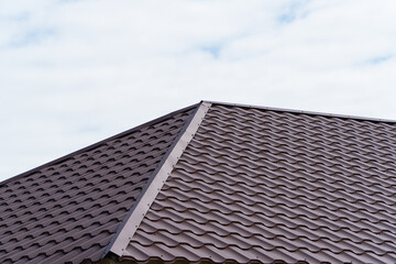 Fototapeta na wymiar Roofing of metal profile. Metal roofing construction