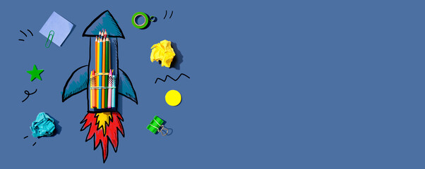Back to school theme with a rocket with school supplies