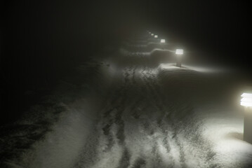 Lights vanishing into darkness, dark night in Reykjavik Iceland