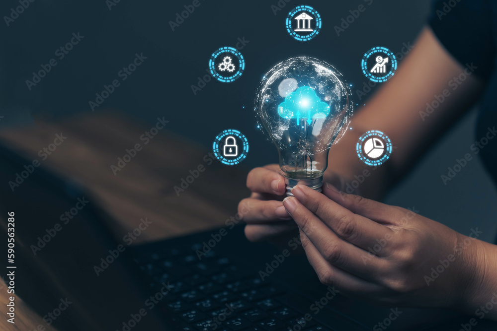 Poster businessman is holding a light bulb that lights up. the concept of uploading data via cloud technolo