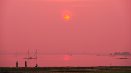 amazing sunrise on the lake.the beauty of the morning light.dark pink light on sunset.select focus.