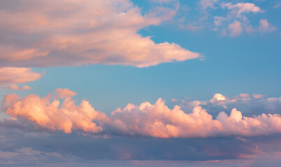 Naklejka na ściany i meble Beautiful evening sky with clouds glowing at sunset