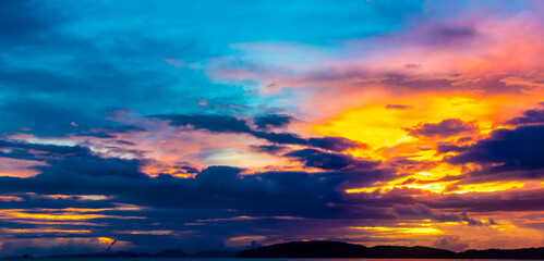 Beautiful stunning colorful and golden sunset Ao Nang Beach Thailand.