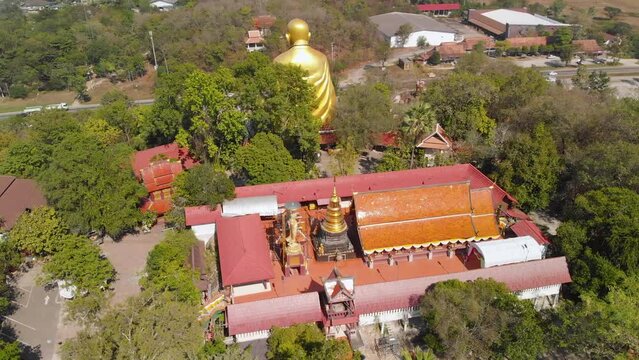 Drone view of a big monk statue close to highway in Chiang Mai, Lampang Road
