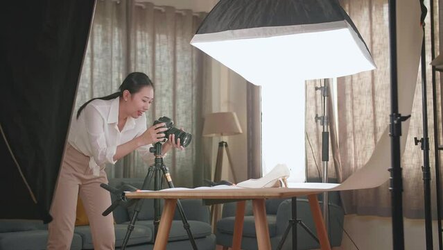 Asian Female Photographer Celebrating Succeed Taking Photos Of Women'S Shoes In Home Studio 
