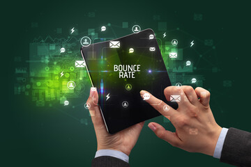 Businessman holding a foldable smartphone, social media concept