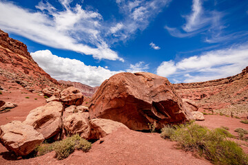 Storm clouds gather over the red sand and boulders at Vermilion Cliffs in northern Arizona.