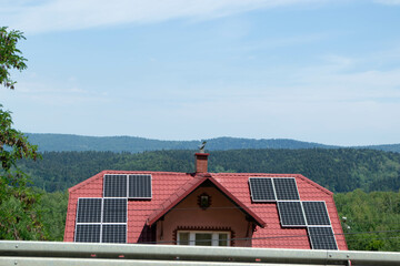 Obraz premium Historic farm house with modern solar panels on roof and wall High quality photo