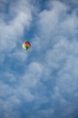 Hot Air Balloon with Beautiful Clouds in Blue Sky
