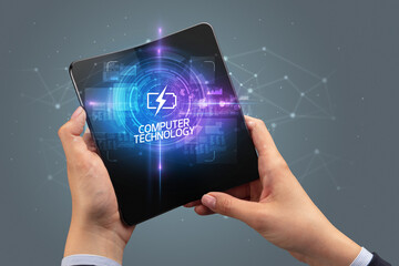 Businessman holding a foldable smartphone, technology concept