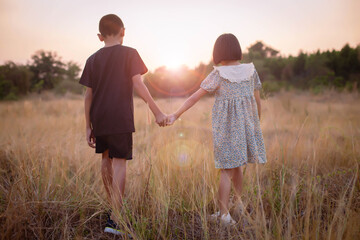 kid silhouette,Moments of the child's joy. On the Nature sunset on soft and blurred background