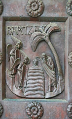 A fragment of the bronze entrance door Baptistery in Pisa, Italy