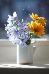 Spring flowers in tiny vase
