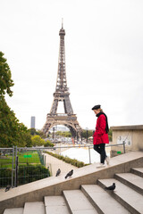 Woman walking in Paris (in front of Eiffel Tower)