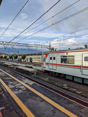 Fototapeta premium train on the railway, train on station, person on railway station, railway in the countryside, bogor station Indonesia