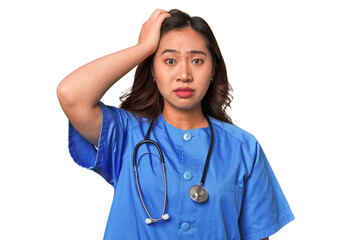 A young nurse chinese woman being shocked, she has remembered important meeting.