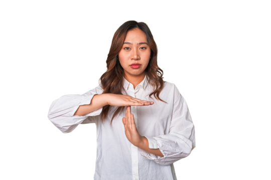 A young chinese woman showing a timeout gesture.
