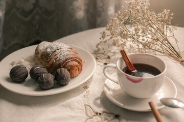 morning cup of coffee with croissant 