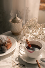 morning cup of coffee with croissant 