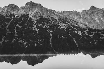 Lake in mountains. Black and white photo.