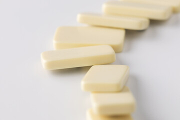 beige domino tiles on a white background