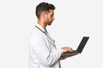 Medical professional working on laptop.