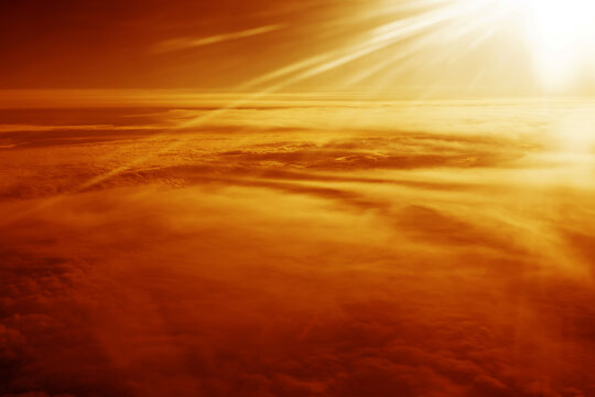 Heaven with sun light rays or beams bursting from clouds in blue sky. Spiritual religious background. Realistic tranquil cloudscape view, beautiful sky paradise backdrop	