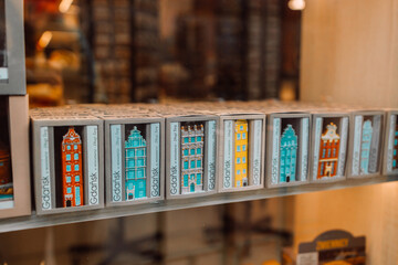 Color ceramic houses, Famous souvenir miniature in a shop window from Gdansk, Poland display on the market, Vintage housing background. High quality photo