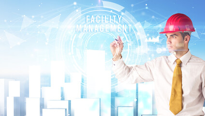 Handsome businessman with helmet drawing