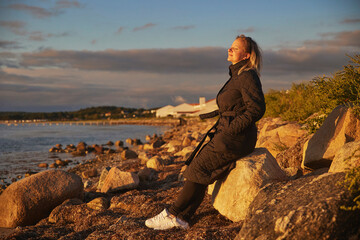 Beautiful woman enjoying the sunset in Denmark