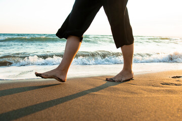 Sandy Steps: A Girl Walking on the Beach © Addy