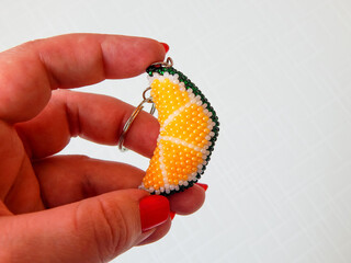 Bright key chain in a female hand