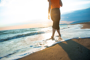 Sandy Steps: A Girl Walking on the Beach